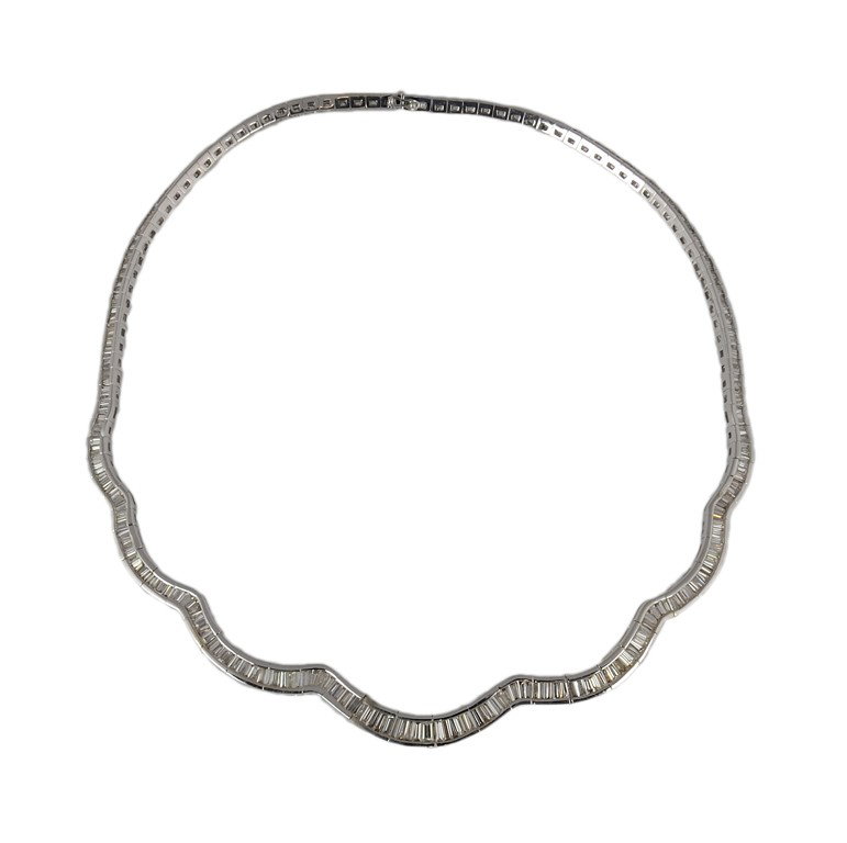 AN 18K CHOKER NECKLACE WITH 16.14 CT IN DIAMONDS: AN 18K CHOKER NECKLACE WITH 16.14 CT IN DIAMONDS Finely crafted in white gold with 367 baguette diamonds = 16.14 Ct., With Color-G to I, Clarity - VS1 to SI1. Measures 18"" in length. 60.8 grams.
