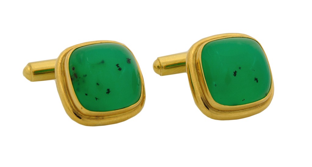 A PAIR OF 18K CHRYSOPRASE CUFFLINKS BY WHITE: A PAIR OF 18K CHRYSOPRASE CUFFLINKS BY WHITE In yellow gold. Set with 14 x 14 MM cushion cab Chrysoprase Chalcedony speckled with a black dendritic pattern. 23.0 grams.