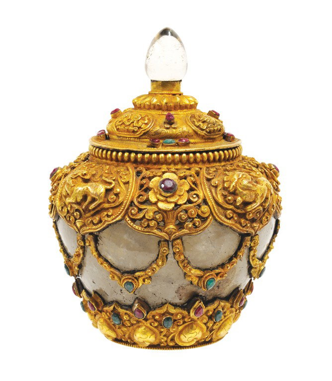 A SOUTHEAST ASIAN ROCK CRYSTAL GILT BRONZE & JEWEL: A SOUTHEAST ASIAN ROCK CRYSTAL GILT BRONZE & JEWEL ENCRUSTED COVERED VESSEL 20th Century The carved rock crystal vessel heavily encrusted with crisply cast gilt bronze mounts featuring nautilus shells