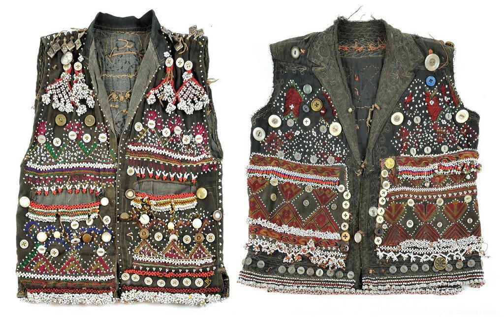 A PAIR OF VINTAGE ERSARI TURKMAN CHILD'S VESTS Tash: A PAIR OF VINTAGE ERSARI TURKMAN CHILD'S VESTS Tashkurghan, Northern Afghanistan 15 ½ x 12 inches (39.3 x 30.4 cm)