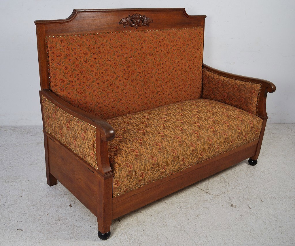 AN UNUSUAL VINTAGE SETTEE: AN UNUSUAL VINTAGE SETTEE With folding arms that convert the seat portion to a bed. 48 x 65 x 30 inches