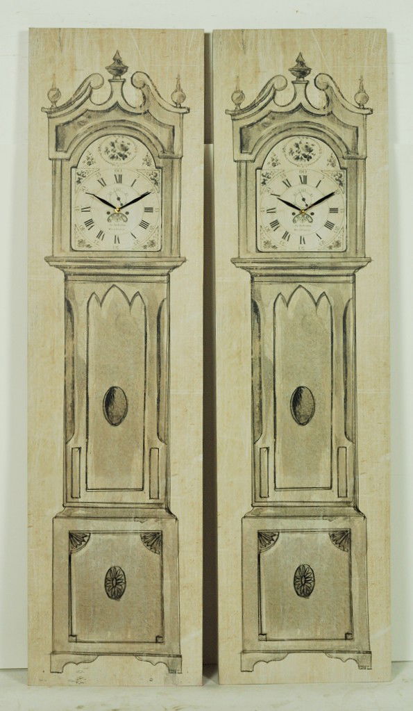 A MATCHING PAIR OF DECORATIVE WALL CLOCKS: A MATCHING PAIR OF DECORATIVE WALL CLOCKS 65 x 35 x 2 inches