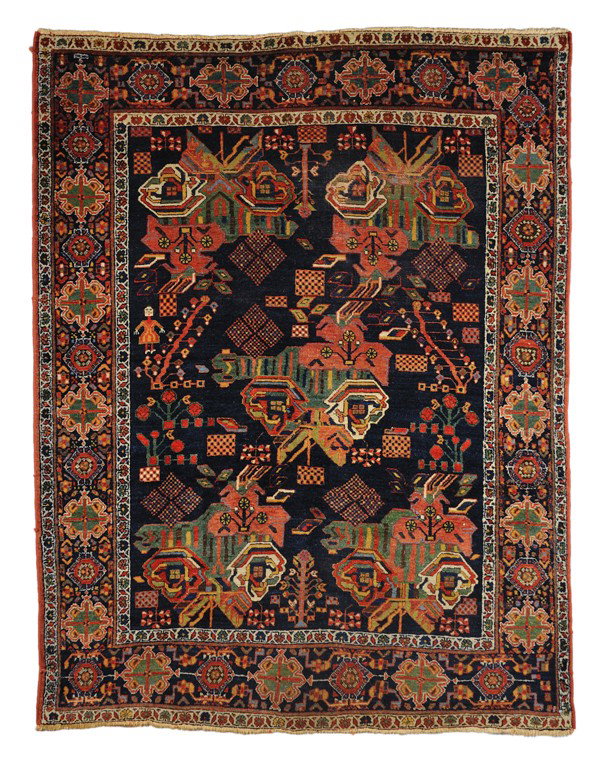 A BIDJAR KURDISH RUG North Persia Circa 1900s 5 ft: A BIDJAR KURDISH RUG North Persia Circa 1900s 5 ft 2 in x 6 ft 8 in (207 x 158 cm) With a highly desirable navy blue field, this impressive sampler of bouquet of roses in a non symmetrical form exhibi