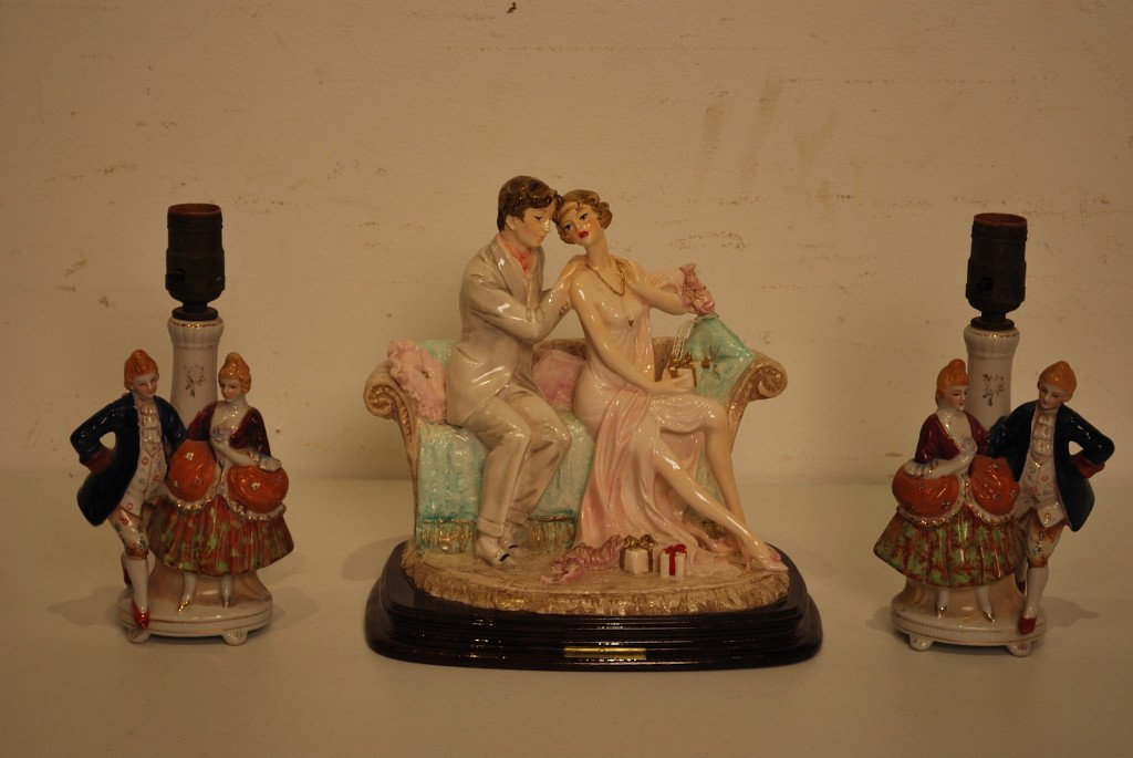A TRIO OF VINTAGE PORCELAIN FIGURES: A TRIO OF VINTAGE PORCELAIN FIGURES Consisting of a pair of figures as lamps and a Santini collectible figural group. 11 x 10 ½ x 7 inches