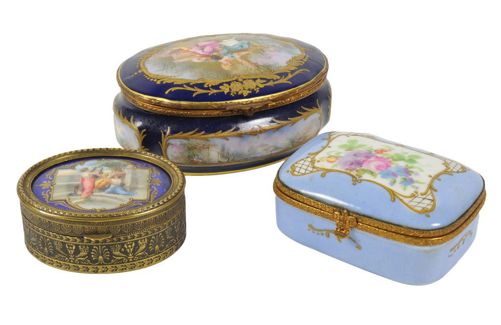 A GROUP OF THREE CONTINENTAL GILT-MOUNTED, GILDED,: A GROUP OF THREE CONTINENTAL GILT-MOUNTED, GILDED, AND ENAMEL DECORATED PORCELAIN LIDDED SNUFF BOXES The Proctor Estate The group consisting of: (A) a Sèvres porcelain oval box with multicolored rese