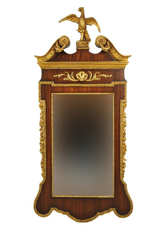 A FEDERAL STYLE MAHOGANY PARCEL GILT WOOD BEVELED : A FEDERAL STYLE MAHOGANY PARCEL GILT WOOD BEVELED MIRROR The gilded broken swan peditment with giltwood dragon form perched on stump above a ribbon mahogany frieze with stepped moulded cornice and pie