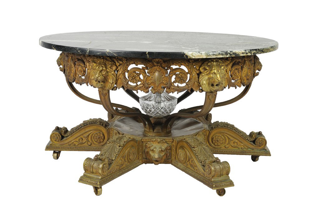 A NEOCLASSIC REVIVAL STYLE CAST BRONZE GLASS AND M: A NEOCLASSIC REVIVAL STYLE CAST BRONZE GLASS AND MARBLE Circa 1920 The verte marble top vigorous white veining and plain edge is supported by a recessed pierce cast apron of lion masks floret scrolls 