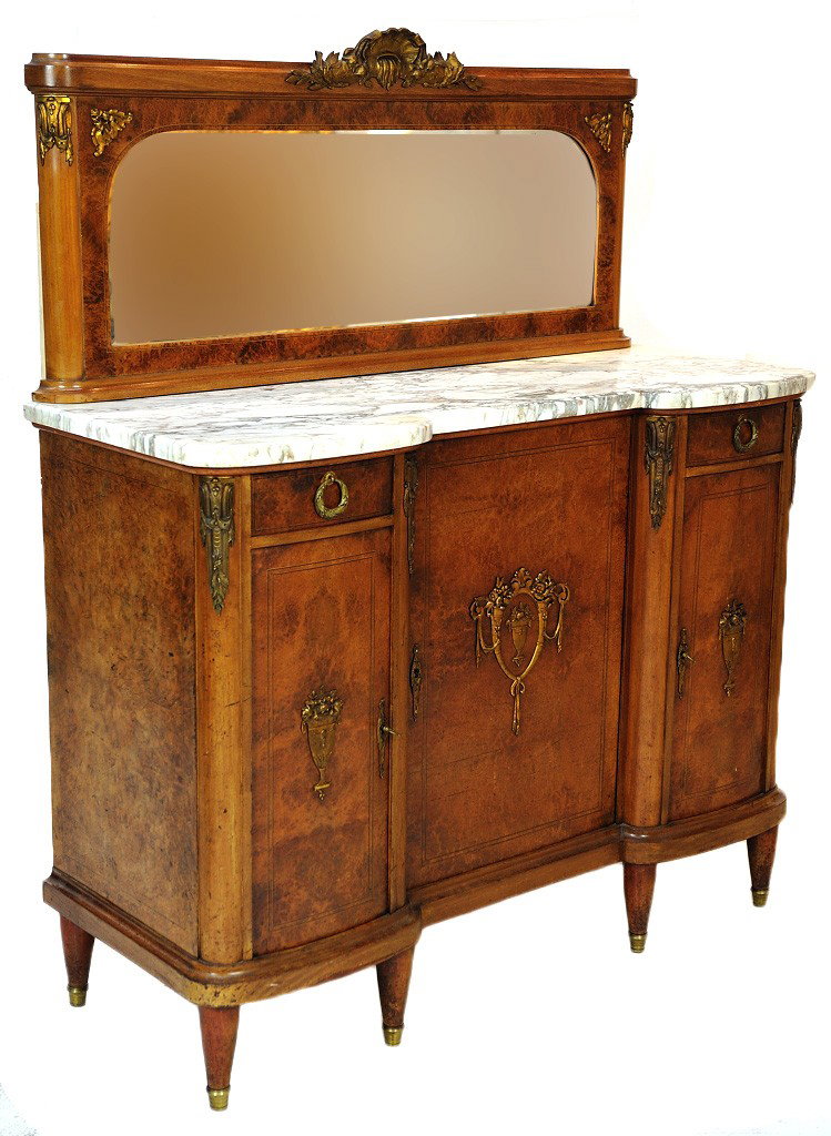 AN EARLY 20TH CENTURY LOUIS XVI INFLUENCED BURLED W: AN EARLY 20TH CENTURY LOUIS XVI INFLUENCED BURLED WALNUT SIDEBOARD Inlaid ebony stringers, marble top & beveled mirror with ormolu mounts & hardware. 62½ x 51½ x 20 inches