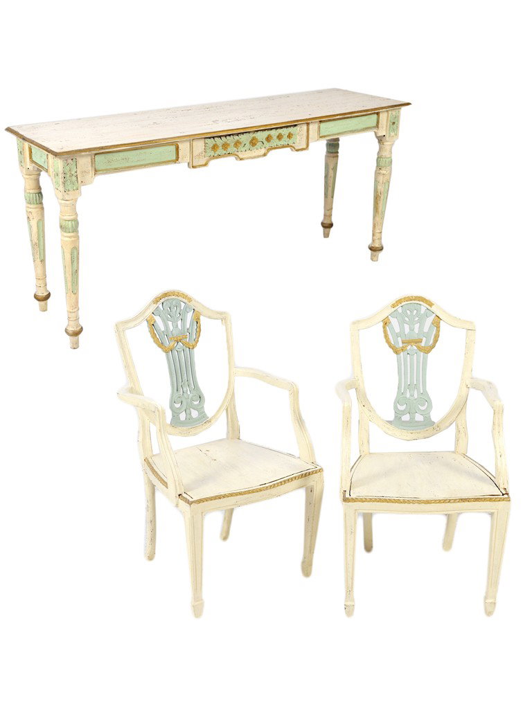 A CARVED AND DECORATED SOFA TABLE GROUPED WITH A PA: A CARVED AND DECORATED SOFA TABLE GROUPED WITH A PAIR OF VINTAGE SHIELD BACK MAHOGANY ARM CHAIRS Finished to match in distressed paint and partial gilt. Table: 30½ x 66 x 19 inches Chairs: 38½ x 22 