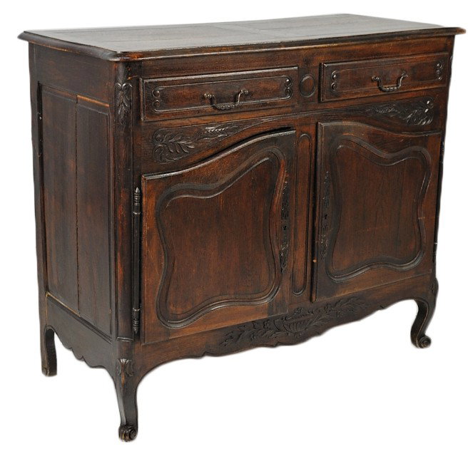 AN 18th CENTURY LOUIS XV STYLE OAK SIDEBOARD: AN 18th CENTURY LOUIS XV STYLE OAK SIDEBOARD Good floral carvings with two drawers over two doors 41½ x 48 x 22 inches