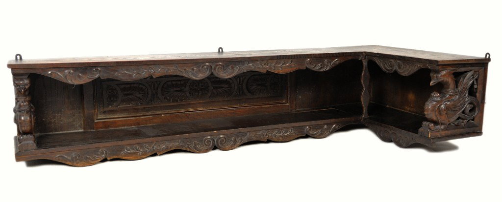 AN ELABORATELY CARVED 19TH CENTURY BLACK FOREST CO: AN ELABORATELY CARVED 19TH CENTURY BLACK FOREST CORNER SHELF 17½ x 79 x 32 inches