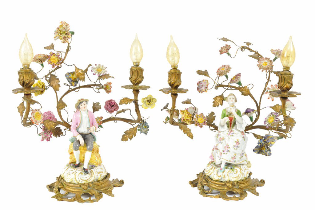 A PAIR OF SMALL FAUBOURG ST. ANTOINE FIGURAL GILT : A PAIR OF SMALL FAUBOURG ST. ANTOINE FIGURAL GILT BRONZE AND PORCELAIN TWO-LIGHT LAMPS France, Figures 19th Century, Light Fixtures Probably Early 20th Century Each lamp consisting of a gilded and dec