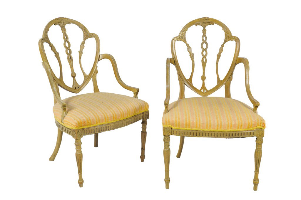 A COMPANION PAIR OF PAINTED HEPPLEWHITE SIDE CHAIR: A COMPANION PAIR OF PAINTED HEPPLEWHITE SIDE CHAIRS 19th Century The delicate arched and curved crest rail with foliate carving and the intertwining pierced carved splat with foliate flourishes at top