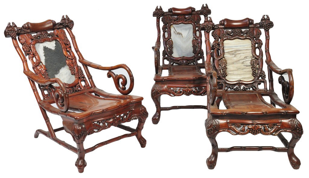 THREE INTRICATELY CARVED LATE 19TH CENTURY ASIAN SLI: THREE INTRICATELY CARVED LATE 19TH CENTURY ASIAN SLING CHAIRS The backs feature beautifully carved detail of grape clusters hanging from leafy vines surrounding a central stone plaque with chickadee r