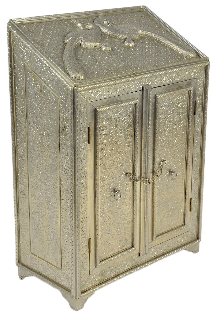 A INTRICATE AND RARE 1890's SILVER SHEATHED TWO DOO: A INTRICATE AND RARE 1890's SILVER SHEATHED TWO DOOR CABINET FROM A PROMINENT BRITISH COLONIAL MANSION Porobably India The Silver metal repousse featuring peacocks on a rose pattern with an all over f