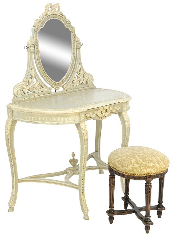 A DELICATE ITALIAN HAND CARVED AND PAINTED VANITY : A DELICATE ITALIAN HAND CARVED AND PAINTED VANITY AND TABORET, 19th Century The heraldic shaped mirror in pale blue and cream painted finish features a carved crenelated bow above a beveled pivoting m