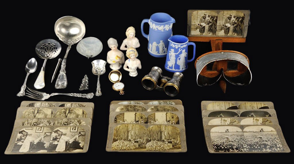 A GOOD LOT OF MIXED VICTORIANA: A GOOD LOT OF MIXED VICTORIANA A stereopticon; Pat. Date Sept. 23, 1897 with 13 cards of mixed subject. A pair of bronze and silver washed repousse opera glasses. Three marked German half dolls. One s