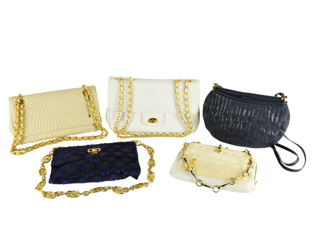 LOT OF FIVE COUTURE PURSES: LOT OF FIVE COUTURE PURSES The lot consisting of five shoulder bags: (1) a Judith Leiber navy blue leather purse with leafy cord decoration, two leather straps, and a mirror and coin purse inside; (2)