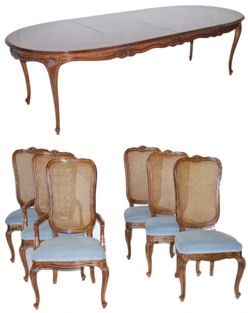 A FRENCH PROVENCAL DINING TABLE AND CHAIRS BY DREX: A FRENCH PROVENCAL DINING TABLE AND CHAIRS BY DREXEL HERITAGE From the "Old Continents" collection. A 40½"" round table with two 22""leaves, together become an 84½"" rectangle with ovoid ends. The t