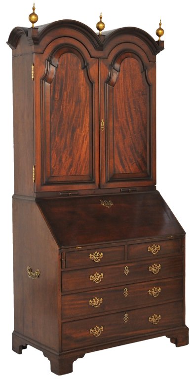 A FINE PERIOD GEORGIAN MAHOGANY SECRETARY, Early 1: A FINE PERIOD GEORGIAN MAHOGANY SECRETARY, Early 19th Century The three turned giltwood finials punctuate the double arched molded cornices supported by a rectilinear body with conforming locking door