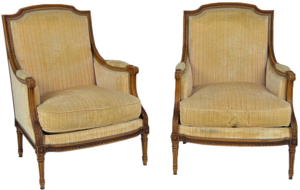 A PAIR OF LOUIS XVI STYLE WALNUT BERGERE'S: A PAIR OF LOUIS XVI STYLE WALNUT BERGERE'S Simple Louis XVI style frame with tapered and fluted legs, block and rosette, acanthus leaf carving and egg and dart in the reserves. Pale yellow silk velvet