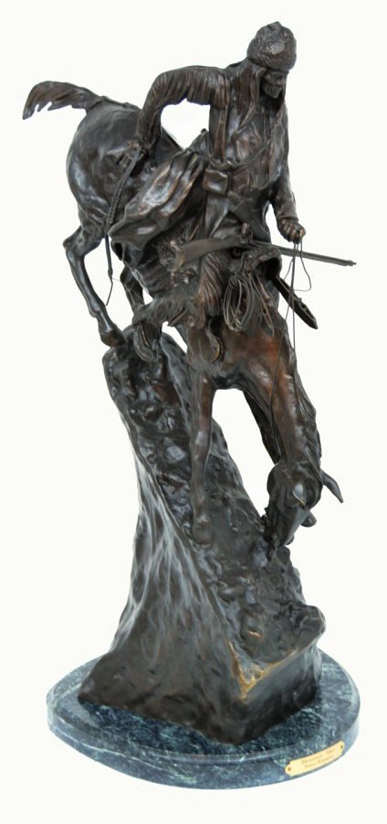 "MOUNTAIN MAN" BY FREDRIC REMINGTON A BRONZE RE-CAS: ""MOUNTAIN MAN"" BY FREDRIC REMINGTON A BRONZE RE-CASTING 20th Century Slowly, the rider descends a summit trail. His horse quivers nervously, lifting a hind leg and front hoof as the pair skid down t