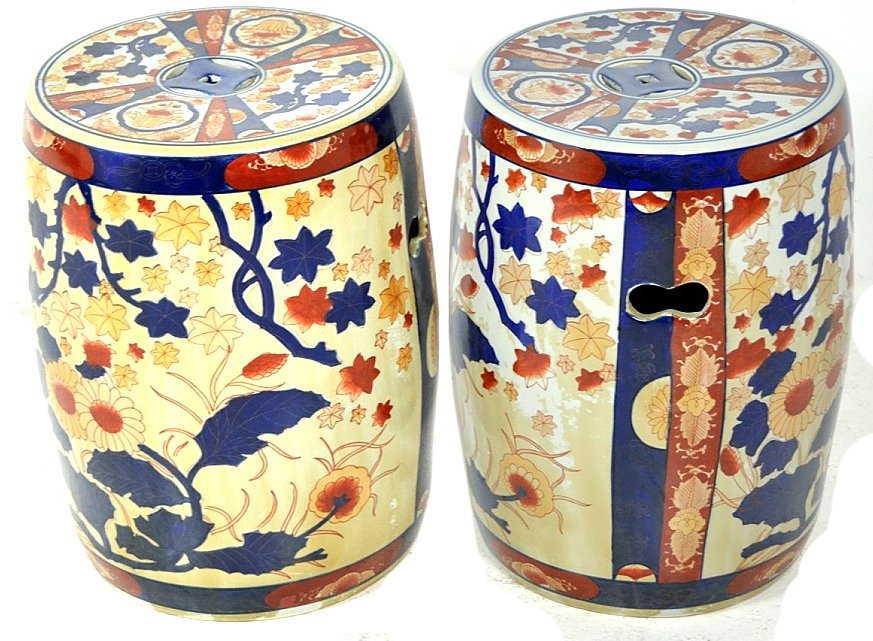 A PAIR OF CHINESE STYLE PORCELAIN GARDEN STOOLS: A PAIR OF CHINESE STYLE PORCELAIN GARDEN STOOLS 20th Century Decorated in the colors of Imari. 17 x 12 x 12 inches