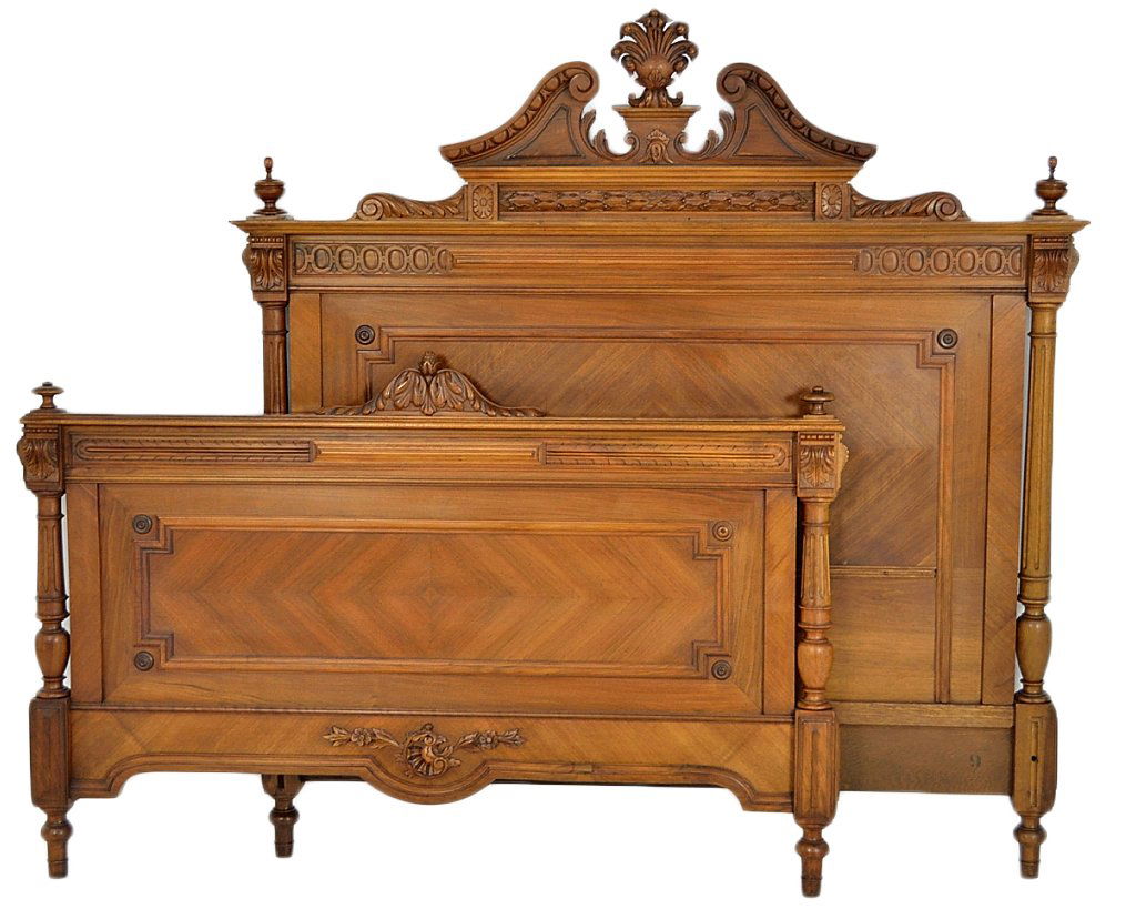 ANTIQUE FRENCH HENRI II CARVED WALNUT BED: ANTIQUE FRENCH HENRI II CARVED WALNUT BED 19th Century With scroll detailed open arch headboard and full reed columns. W: 52½ inches