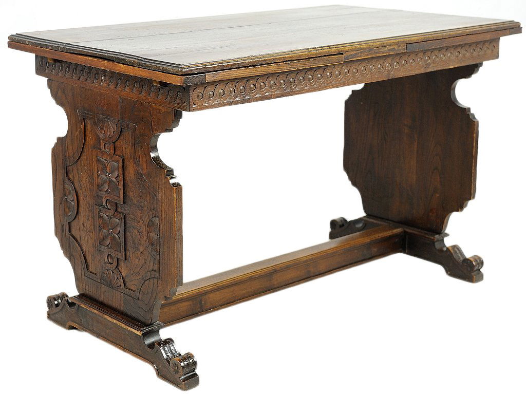 RENAISSANCE REVIVAL STYLE DRAW LEAF TABLE: RENAISSANCE REVIVAL STYLE DRAW LEAF TABLE Early 20th Century The table of Oak with two pull out leaves features floral carved end panels, scrolling corbel type foot with a single conecting stretcher.