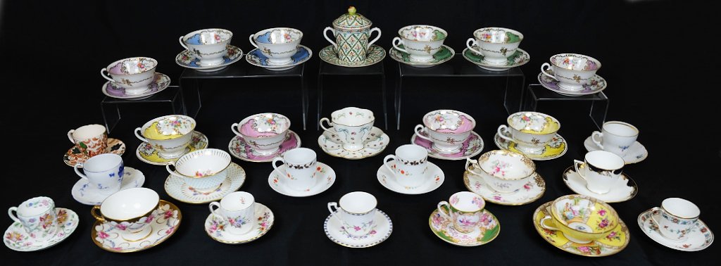 A GROUP OF 27 PORCELAIN CUPS WITH MATCHING SAUCERS: A GROUP OF 27 PORCELAIN CUPS WITH MATCHING SAUCERS Mid 20th Century Including a set of ten Monarch China teacups, two each of five different colors; five miscellaneous teacups (1 Dresden, 1 Minton, 2 