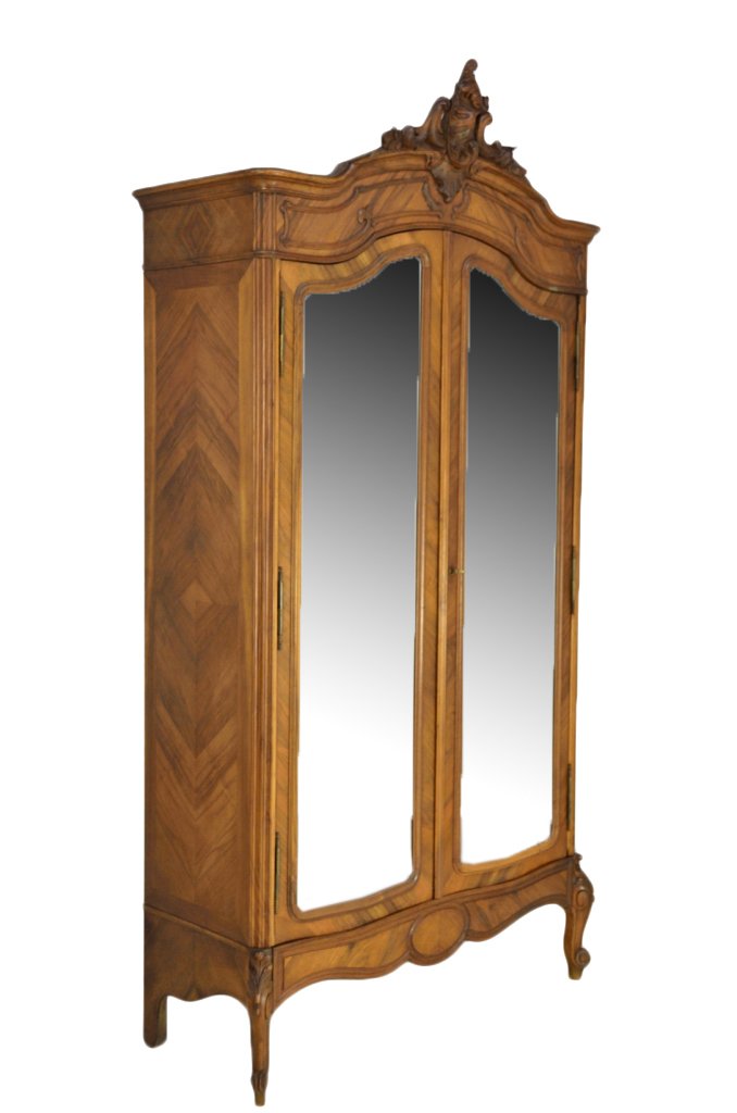 LOUIS XV STYLE WALNUT ARMOIRE: LOUIS XV STYLE WALNUT ARMOIRE 19th Century The arched bonnet is accented by a shell and foliate carving, with conforming frieze panels and full length mirrored doors. The apron with soft scallop meeti