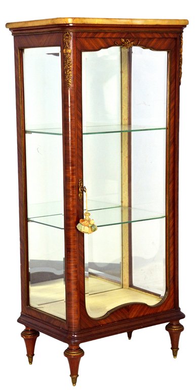 A LOUIS XVI STYLE ROSEWOOD VITRINE WITH DORE' TRIM: A LOUIS XVI STYLE ROSEWOOD VITRINE WITH DORE' TRIM AND MARBLE TOP 1st quarter 20th Century Bronze dore' floral mounts decorate the upper corners, door and feet, a bronze beaded tape lining all glass. 