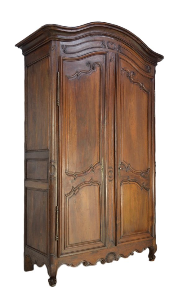 18th CENTURY LOUIS XV PROVENCAL STYLE WALNUT ARMOI: 18th CENTURY LOUIS XV PROVENCAL STYLE WALNUT ARMOIRE 18th Century A softly arched bonnet with deep cove molded cornice, two conforming form doors with coquille shape raised door panels, scalloped apro