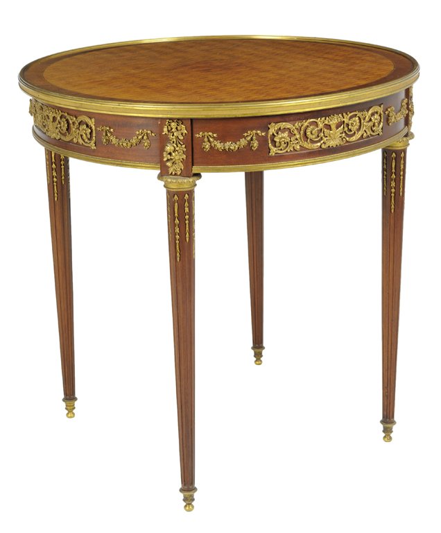 A LOUIS XVI STYLE PARQUETRY BOUILLOTTE TABLE WITH: A LOUIS XVI STYLE PARQUETRY BOUILLOTTE TABLE WITH ORMOLU MOUNTS Continental, 20th Century, The Estate of Mr. and Mrs. Alfred de Marigny A circular top of sapele wood diamond parquetry with gilt bronze