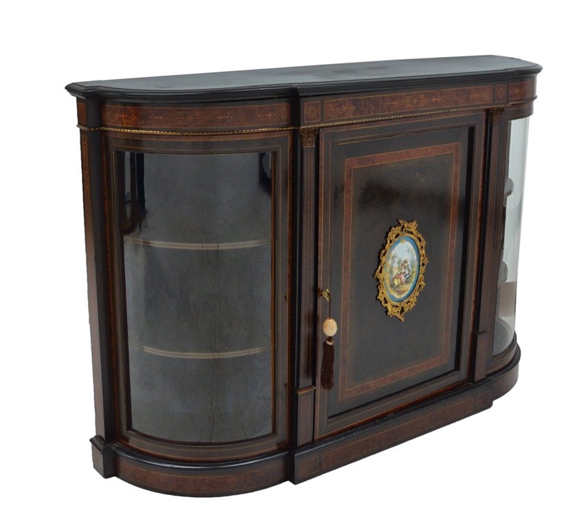 A LOUIS XVI TRANSITIONAL BURL BIRCH, EBONIZED AND: A LOUIS XVI TRANSITIONAL BURL BIRCH, EBONIZED AND ORMOLU MOUNTED SIDEBOARD Early 20th Century The stepped ebonized top with radiused corners is supported by a conforming body featuring ormolu mounts,