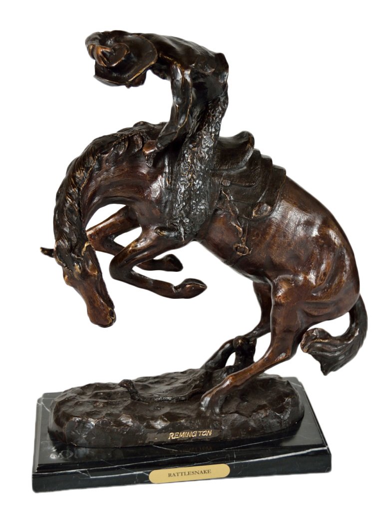 A PATINATED BRONZE SCULPTURE OF “THE RATTLESNAKE” A: A PATINATED BRONZE SCULPTURE OF “THE RATTLESNAKE” AFTER REMINGTON Possibly American, 20th Century The sculpture depicting a cowboy riding a horse that is spooked by a rattlesnake on the uneven gro