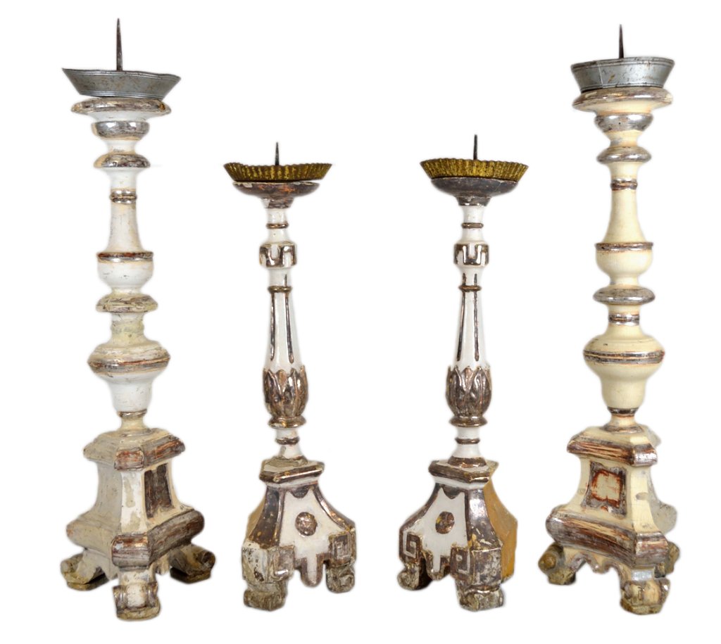 TWO PAIRS OF CARVED AND PARTIAL GILT ALTAR CANDLES: TWO PAIRS OF CARVED AND PARTIAL GILT ALTAR CANDLESTICKS Mid 20th Century Each of the four white-painted wood candlesticks having a central column supporting a removable metal candlecup, all resting on