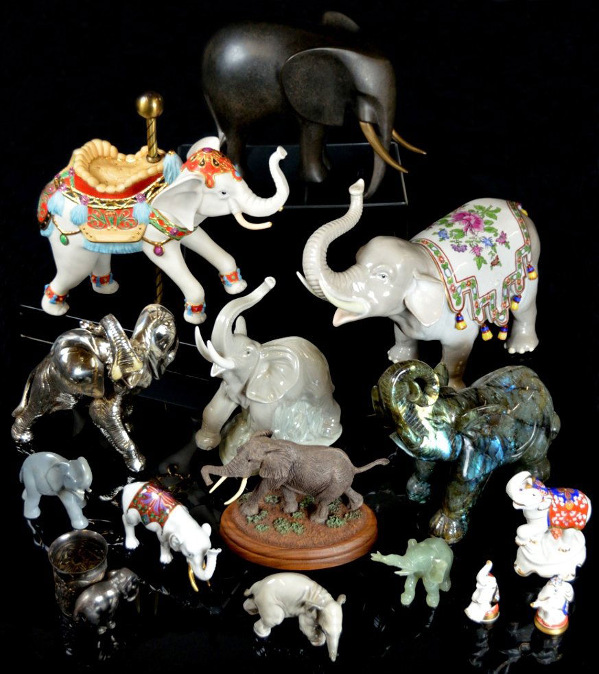 A MIXED LOT OF 15 ELEPHANT FIGURINES: A MIXED LOT OF 15 ELEPHANT FIGURINES Including: 9 of porcelain (2 Lladró, 2 Dresden, 4 other German, 1 large Cybis on a stand), 2 of stone (1 jade, 1 greenstone?), 3 of metal (1 silvered, 1 signed br