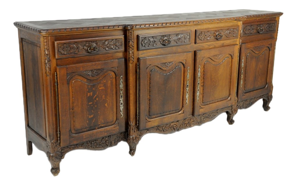 LOUIS XV STYLE OAK INFILADE WITH BASKETWEAVE PARQU: LOUIS XV STYLE OAK INFILADE WITH BASKETWEAVE PARQUTRY TOP Late 19th/early 20th Century A large four door and four drawer infilade with stepped center. The drawers and shaped apron heavily carved in fl