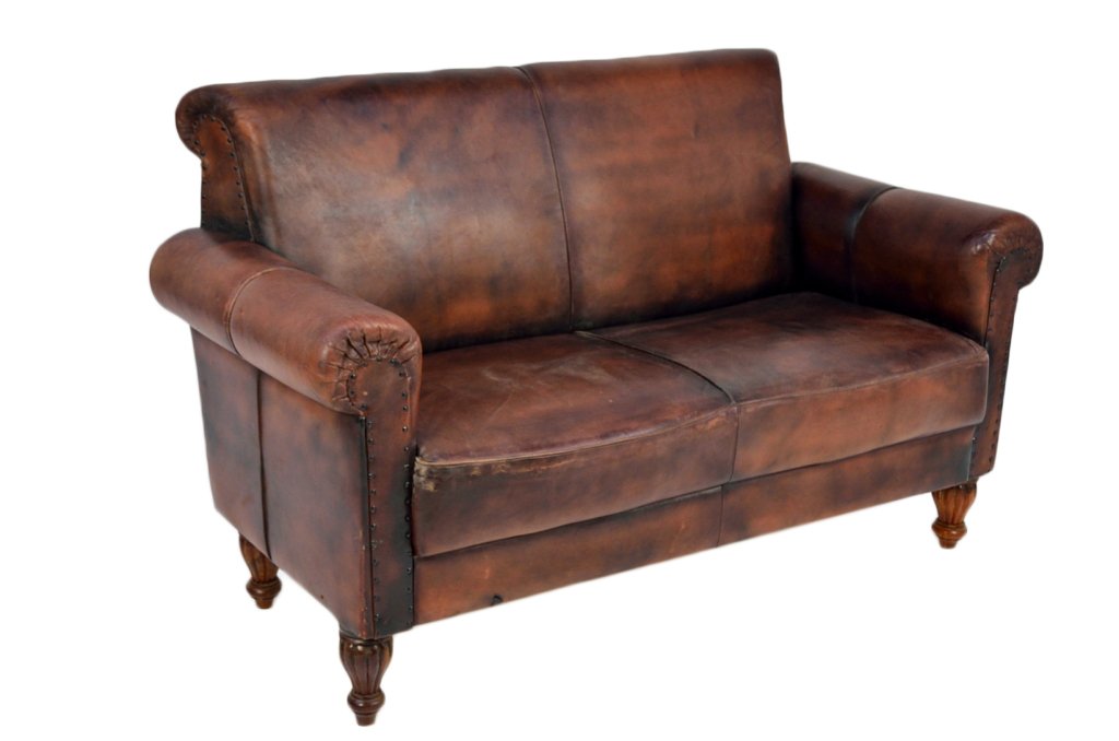 A VINTAGE LEATHER AND TEAK LOVESEAT: A VINTAGE LEATHER AND TEAK LOVESEAT 36½ x 60 x 20 inches
