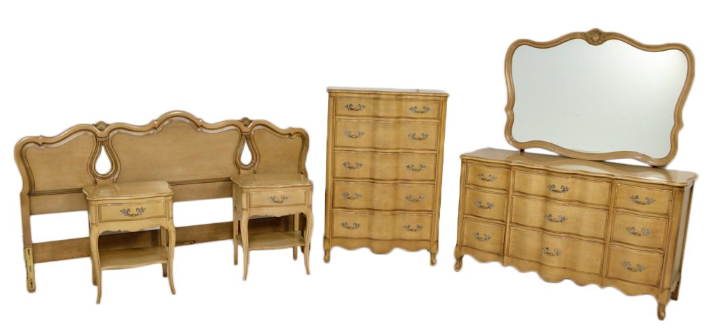 FRENCH PROVENCAL STYLE BLOND MAHOGANY KING BEDROOM: FRENCH PROVENCAL STYLE BLOND MAHOGANY KING BEDROOM GROUP Mid 20th Century Consisting of shaped king headboard and two night stands, serpentine front five drawer chest and nine drawer triple dresser wi