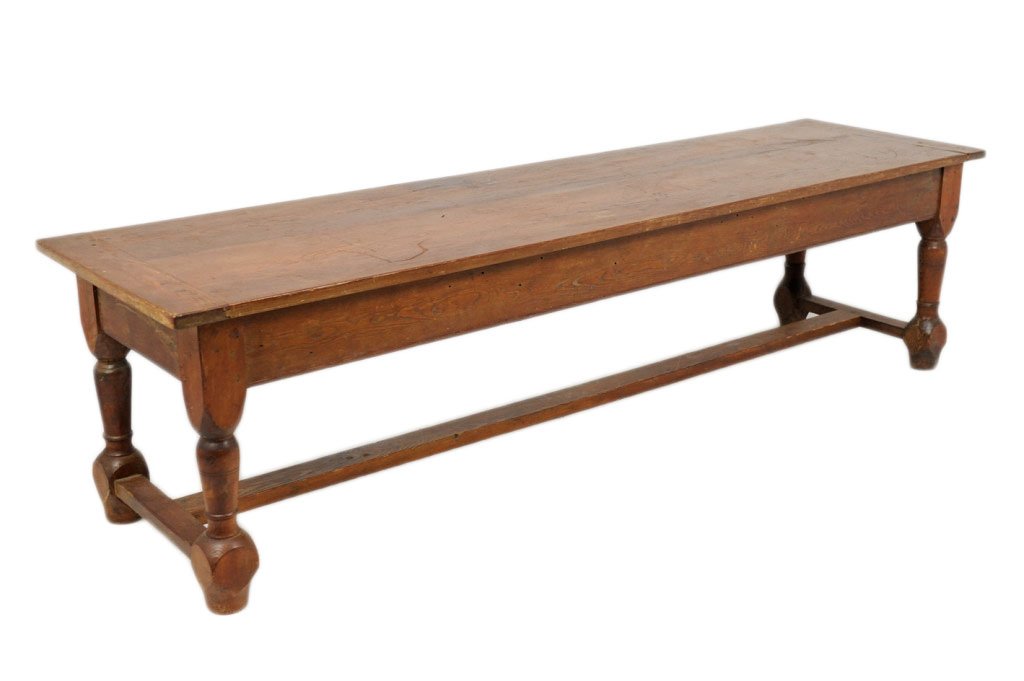 ANTIQUE PROVINCAL FRENCH PINE BENCH: ANTIQUE PROVINCAL FRENCH PINE BENCH 19th Century Plank top with end banding, simple apron with turned legs, stabilized with an H stretcher. Tall enough to serve behind or in front of a sofa in a casua