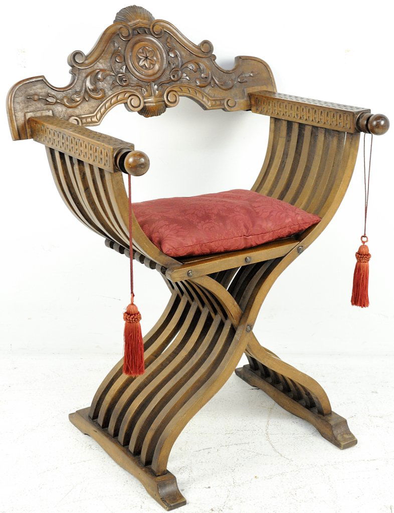 ANTIQUE ITALIAN CARVED WALNUT SAVONAROLA: ANTIQUE ITALIAN CARVED WALNUT SAVONAROLA 19th Century Walnut, incise carved arms with ball end caps having wood ring decoration from which silk tassles hang. The shapely back feature carved scrolls to