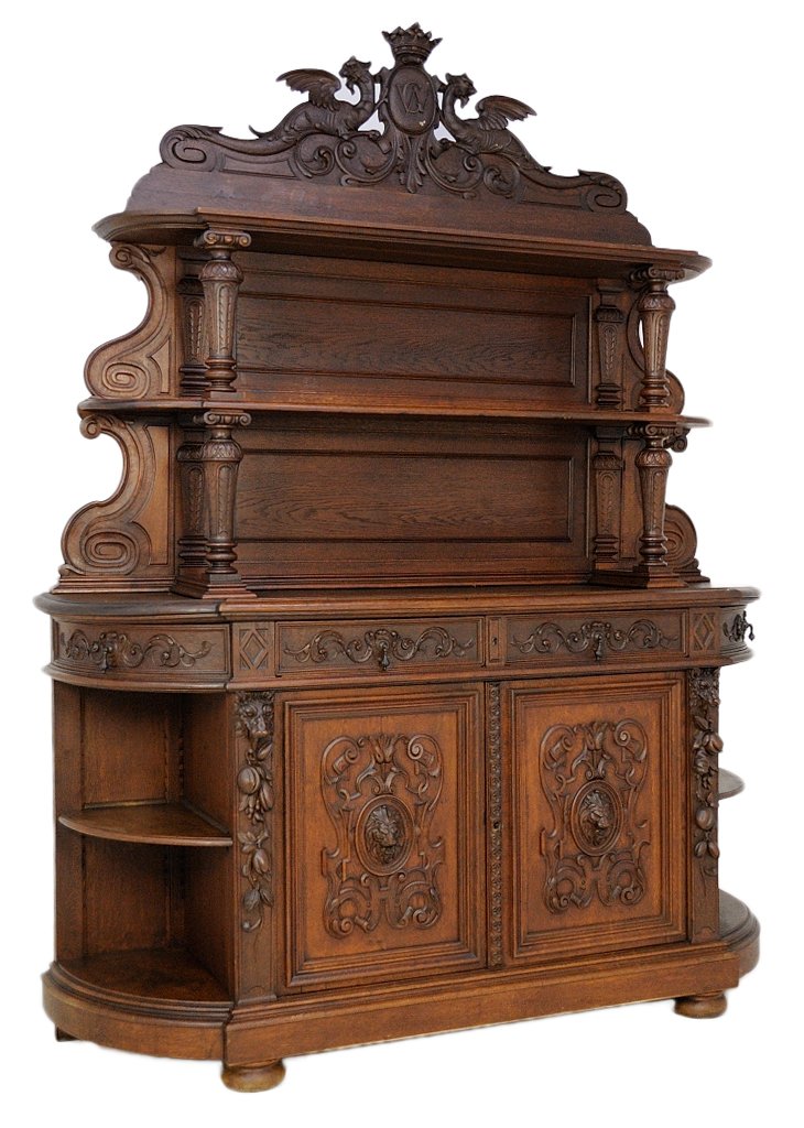 ANTIQUE FRENCH VICTORIAN BUFFET: ANTIQUE FRENCH VICTORIAN BUFFET 19th Century A large and impressive solid oak demi lune shape base cabinet with open end shelving that flanks the central double doors, each door with carved frieze dra