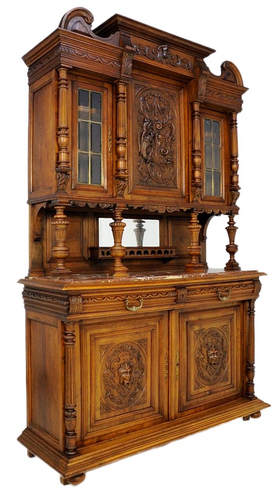 ANTIQUE HENRI II WALNUT BUFFET: ANTIQUE HENRI II WALNUT BUFFET 19th Century Exquisite hand carved door panels with turned and carved post supports, plate rack with mirror under top cabinets overhang, glazed doors above, flanking a p