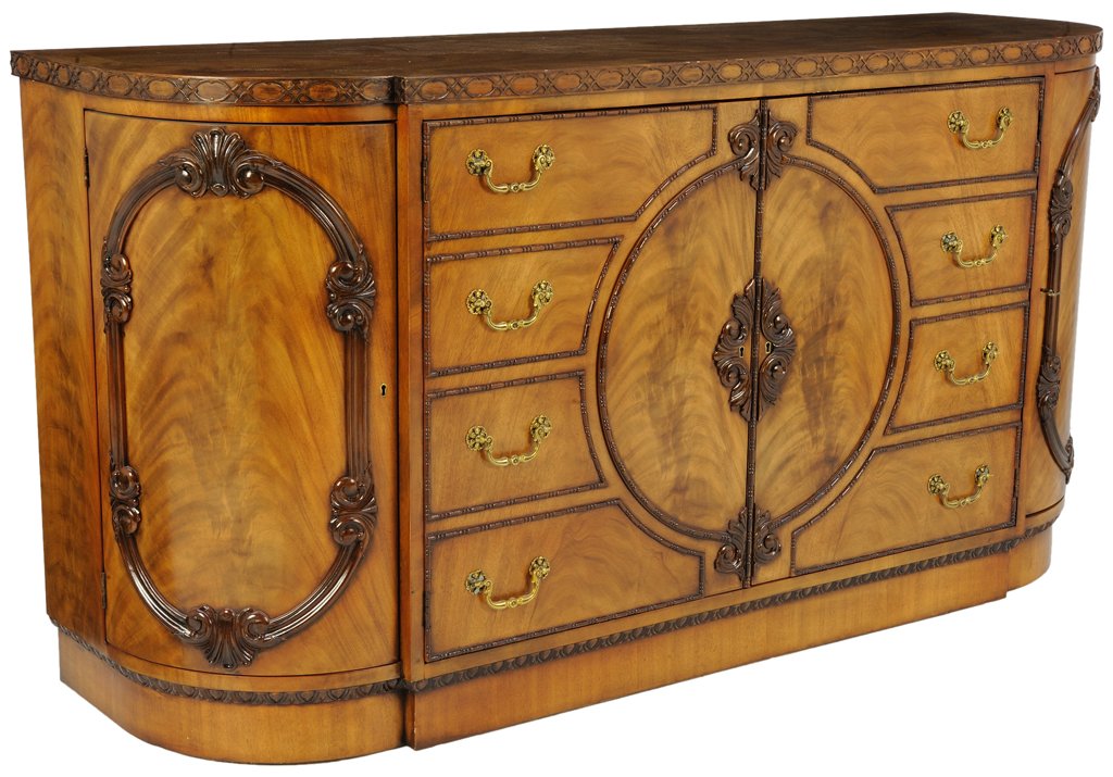 A FINE E. J. VICTOR FIGURED WALNUT SIDEBOARD: A FINE E. J. VICTOR FIGURED WALNUT SIDEBOARD America, 20th Century The burl walnut reserve of the radiused, stepped and banded top is adorned with Chippendale style pierced fretwork edge. The top is s