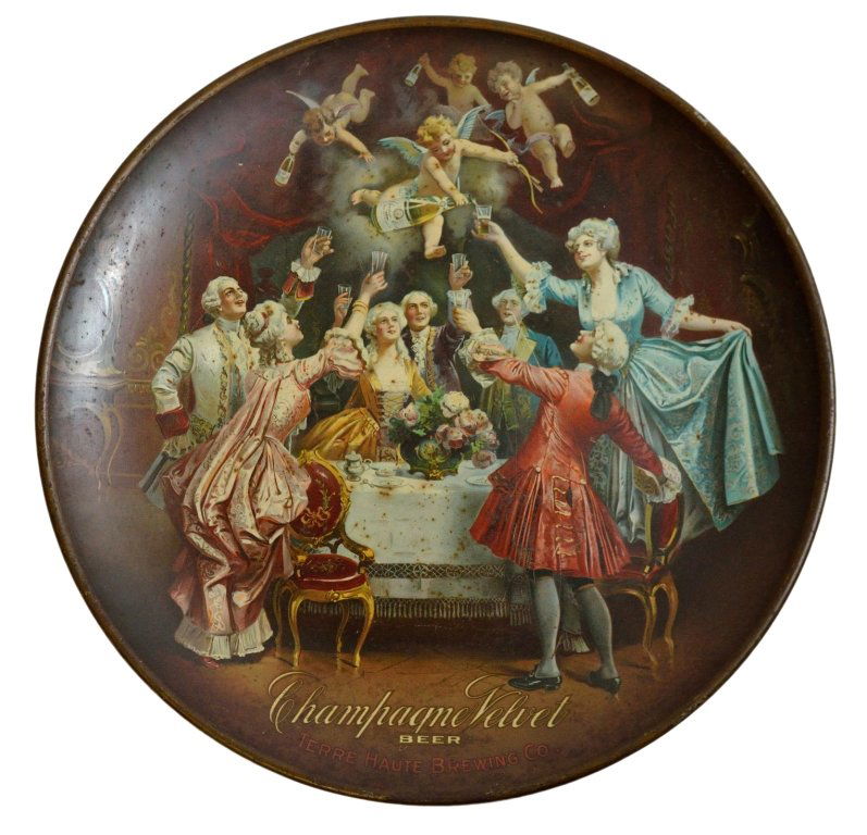 ANTIQUE TERRE HAUTE BREWING CO. TRAY: ANTIQUE TERRE HAUTE BREWING CO. TRAY American, ca. 1905 “CHAMPAGNE VELVET BEER” ; the round copper alloy sign in the shape of a large charger with a humorous lithographic scene of formally dressed