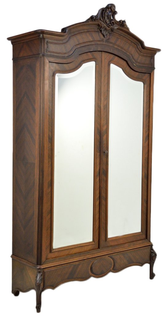 ANTIQUE FRENCH ROSEWOOD ARMOIRE: ANTIQUE FRENCH ROSEWOOD ARMOIRE Late 19th Century Louis XV style, arched bonnet with floral and shell foliate carved crest, molded panel frieze, conforming double doors with beveled mirrors, and a sof