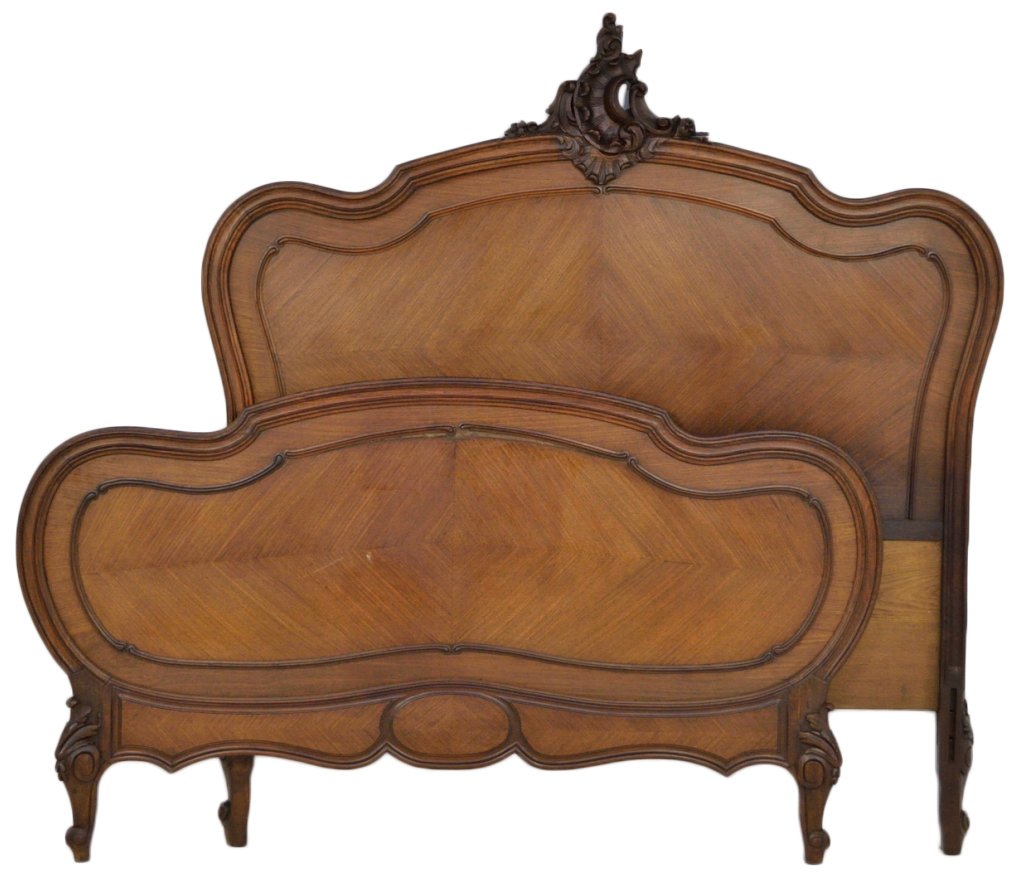 ANTIQUE FRENCH ROSEWOOD BED: ANTIQUE FRENCH ROSEWOOD BED Late 19th Century Louis XV style, arched head and footboard with conforming raised mold panel encircling chevron pattern veneer. Pierce carved floral and foliate crest surm
