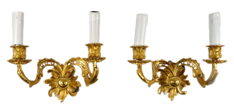 TWO LOUIS XV BRONZE DORE SCONCE: TWO LOUIS XV BRONZE DORE SCONCE 20th Century A pair of Louis XV style finely cast and hand finished bronze dore wall sconces. Chased barky detail covers the floral and foliate candle cups, bobeche dri